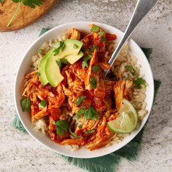 Instapot tequila salsa chicken recipe in a bowl with lime garnish