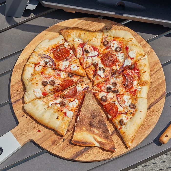 Pizza slices on wooden board